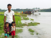 Crowds gather near float plane, Bangladesh